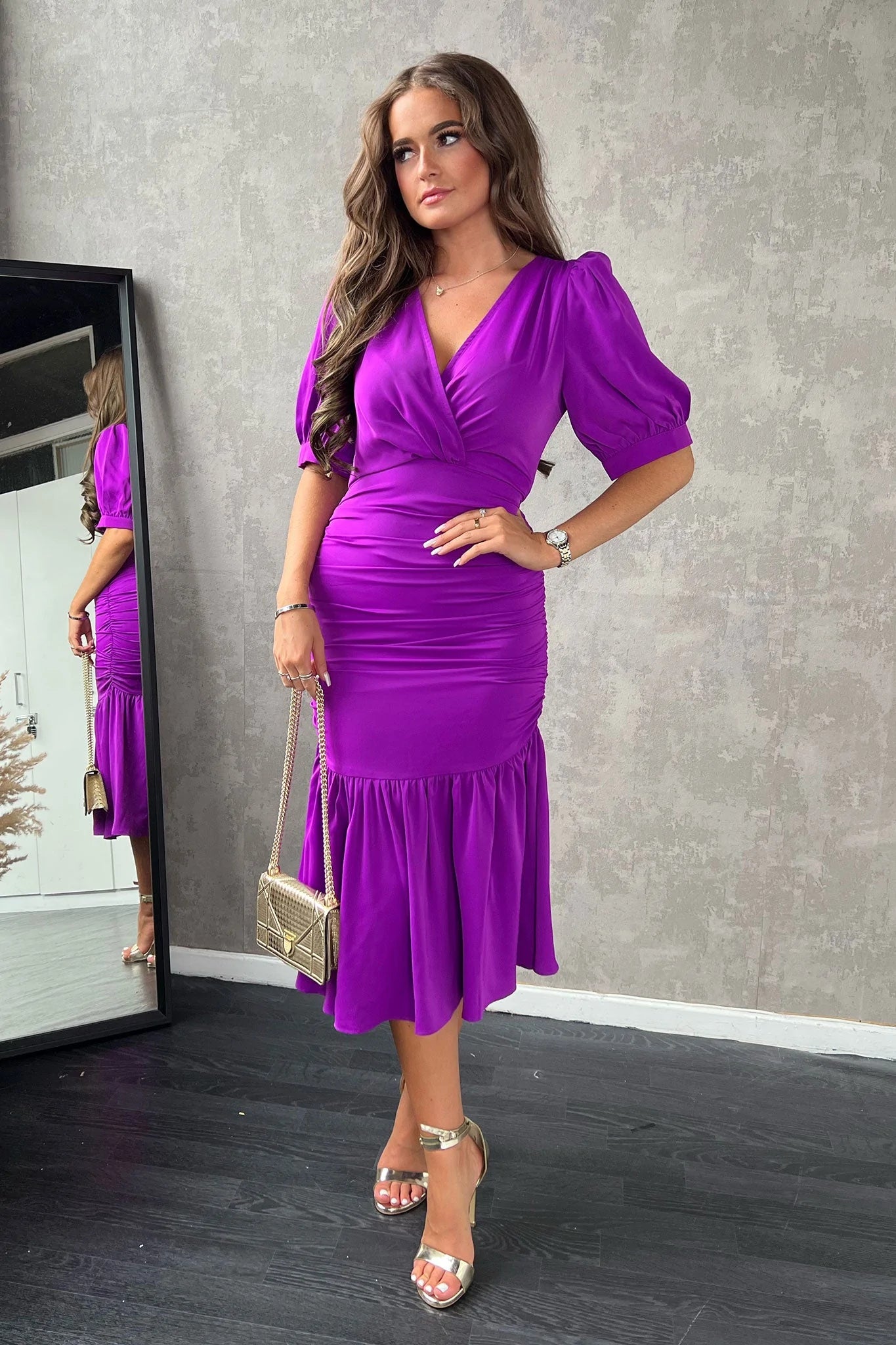 Midi dresses with ruffled hems for a romantic date night Nina Orchid Puff Sleeve Ruched Midi Dress Midi dresses with ruffled hems for a romantic date night Nina Orchid Puff Sleeve Ruched Midi Dress