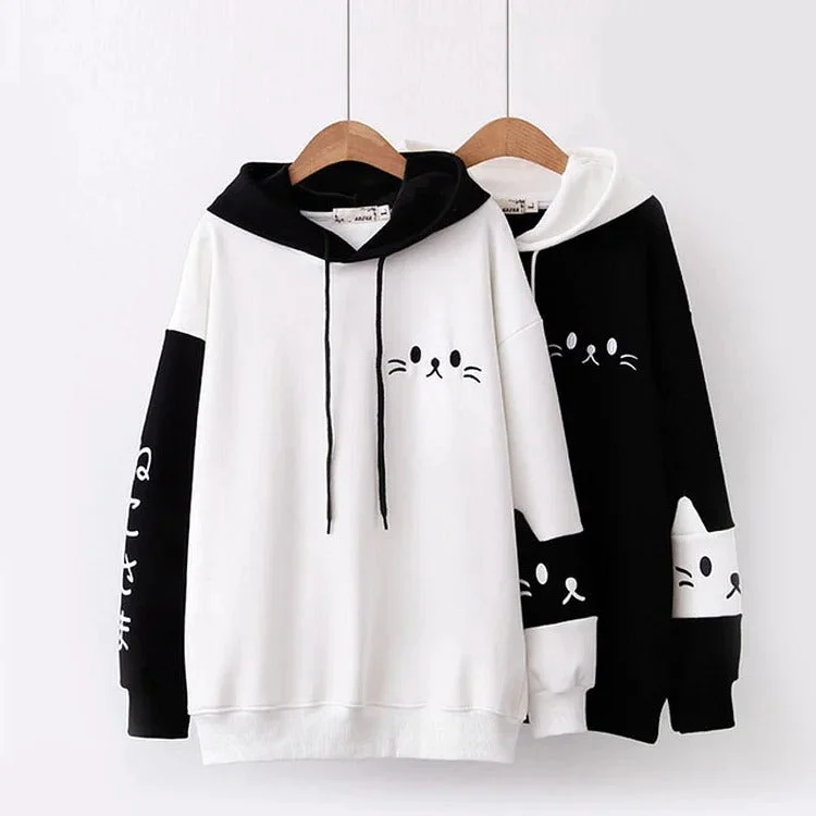 Women's hoodie with a kangaroo pocket and a pom - pom drawstring for added charmAdorable Kitty Magic: Harajuku Cartoon Face Letter Print Hoodie - Snuggle Up to Cute Comfort! ??