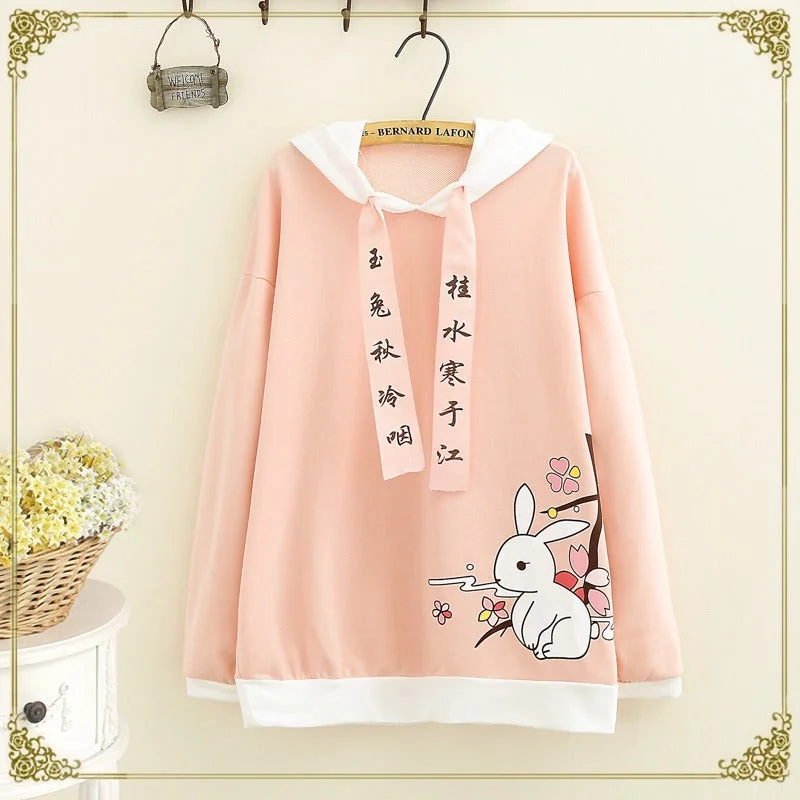 Women's tie - front hoodie in a lightweight fabric for summer layeringSakura Bunny Bliss: Cartoon Rabbit Letter Drawstring Hoodie - Embrace the Charm of Pink Petals! ?? Women's tie - front hoodie in a lightweight fabric for summer layeringSakura Bunny Bliss: Cartoon Rabbit Letter Drawstring Hoodie - Embrace the Charm of Pink Petals! ??