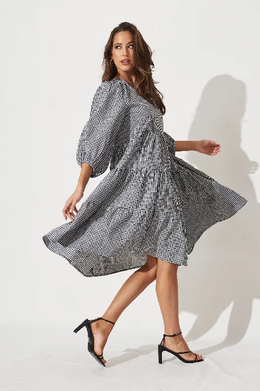 Midi dresses with abstract art prints for an artistic statementKehlana Tiered Smock Dress in Black and White Gingham Midi dresses with abstract art prints for an artistic statementKehlana Tiered Smock Dress in Black and White Gingham