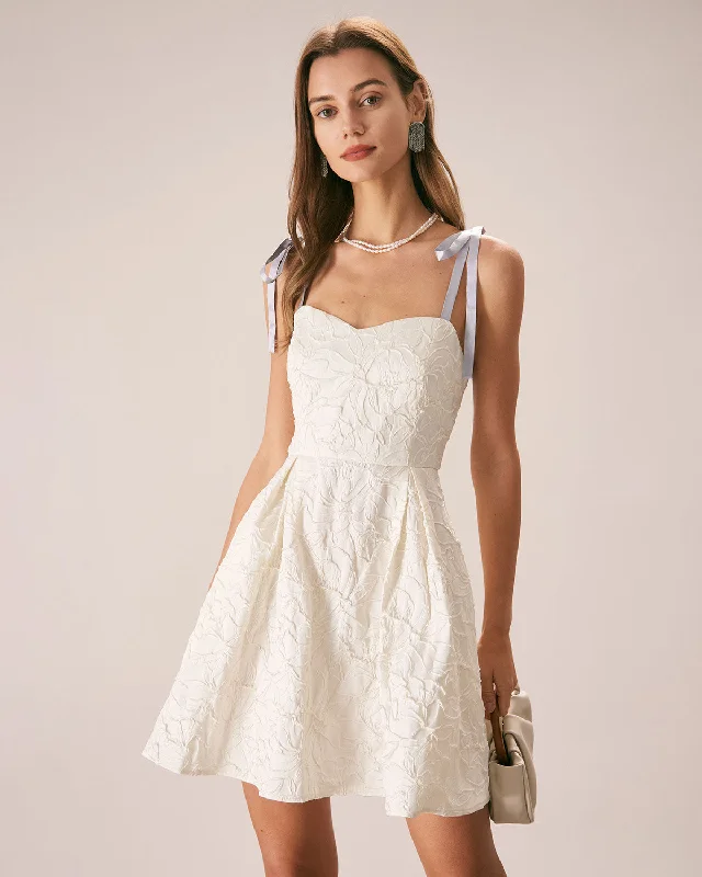Mini dresses with V - necklines for a flattering shapeThe Off White Jacquard Tie Strap Mini Dress Mini dresses with V - necklines for a flattering shapeThe Off White Jacquard Tie Strap Mini Dress